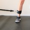 resistance band connected to ankle strap for leg exercise