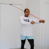 picture of person doing at home arm exercises using a light resistance power band